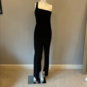 Likely elegant Black One-Shoulder gown.